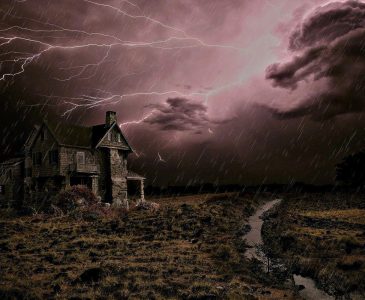 Old Two-Story House in a Thunderstorm with Lightning and Rain with a Stream of Water