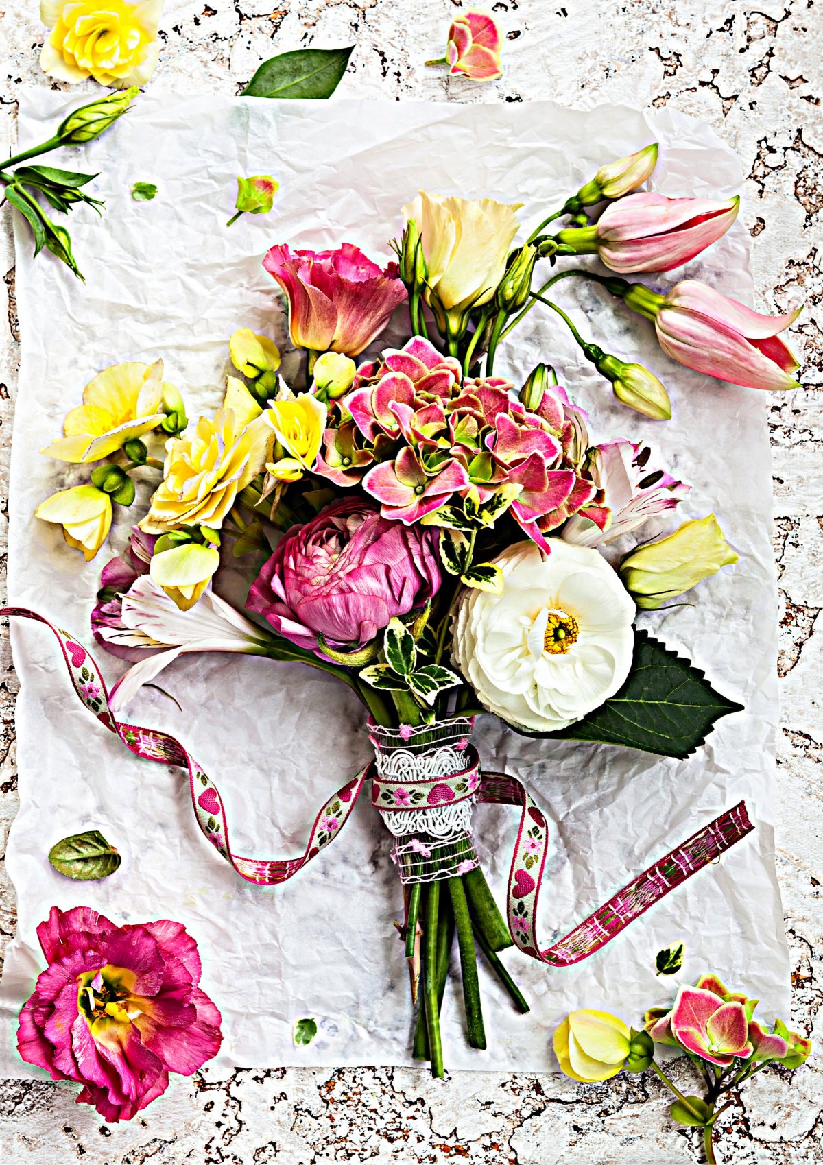 Floral Bouquet of Pink, Yellow, and White Mixed Flowers on White Doilie with Ribbon
